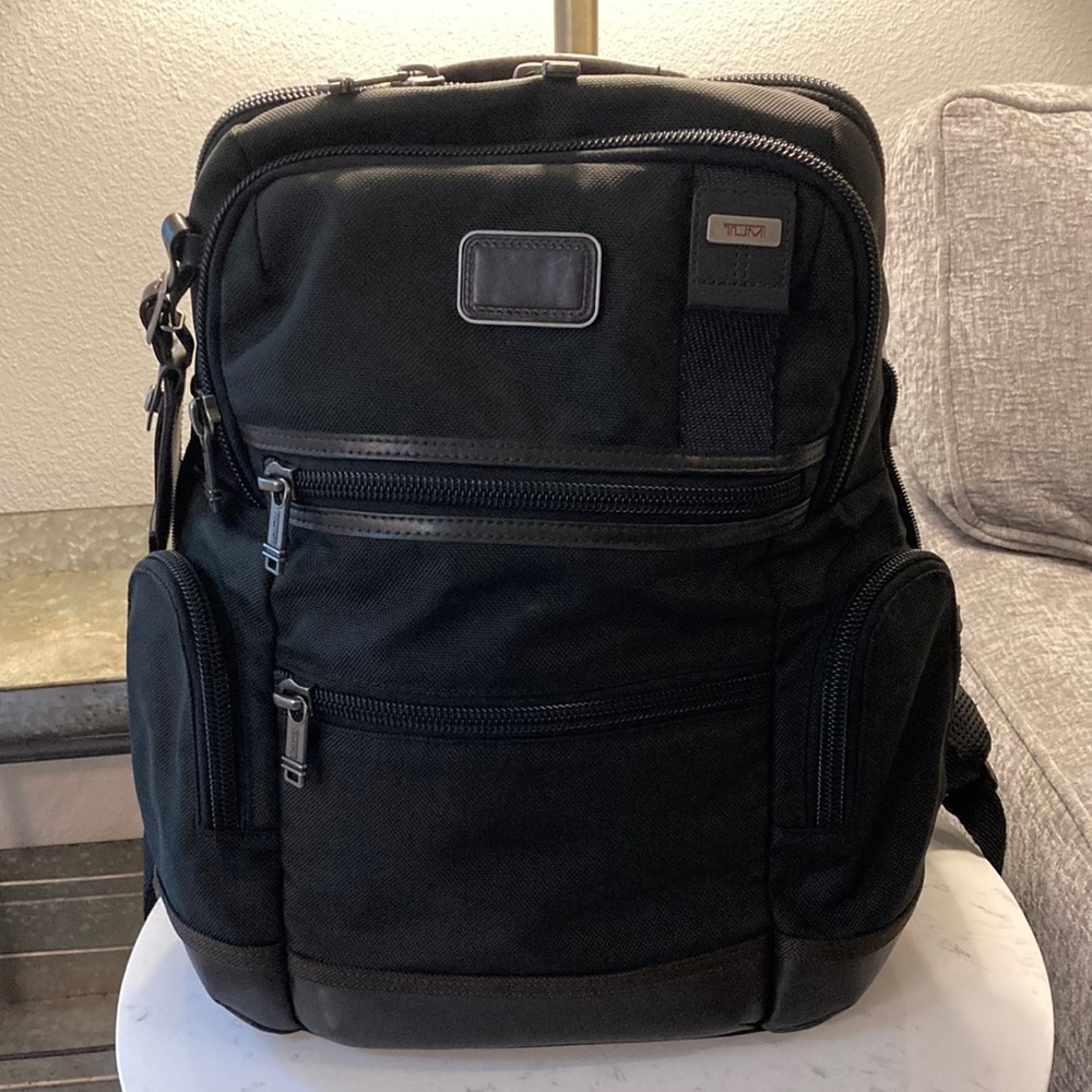 TUMI Knox Backpack. Black w/brown leather. In great condition.